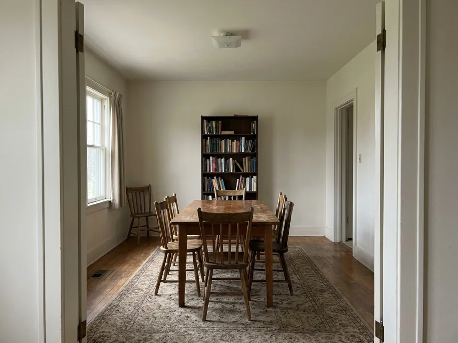 Study library refreshed with a long table, task lamps, and a quieter palette. before AI redesign