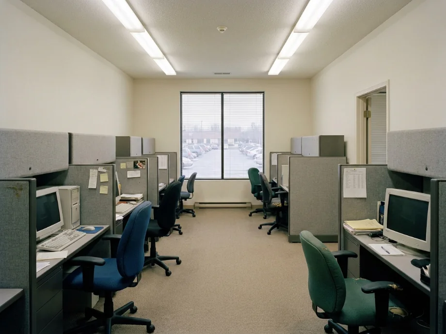 Open office restyled with benching desks, phone booths, and a collaboration zone. before AI redesign