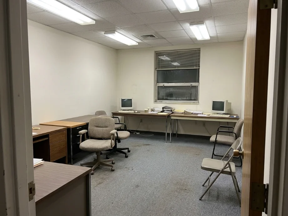 Hybrid office refreshed with hotel desks, a huddle room, and acoustic panels. before AI redesign