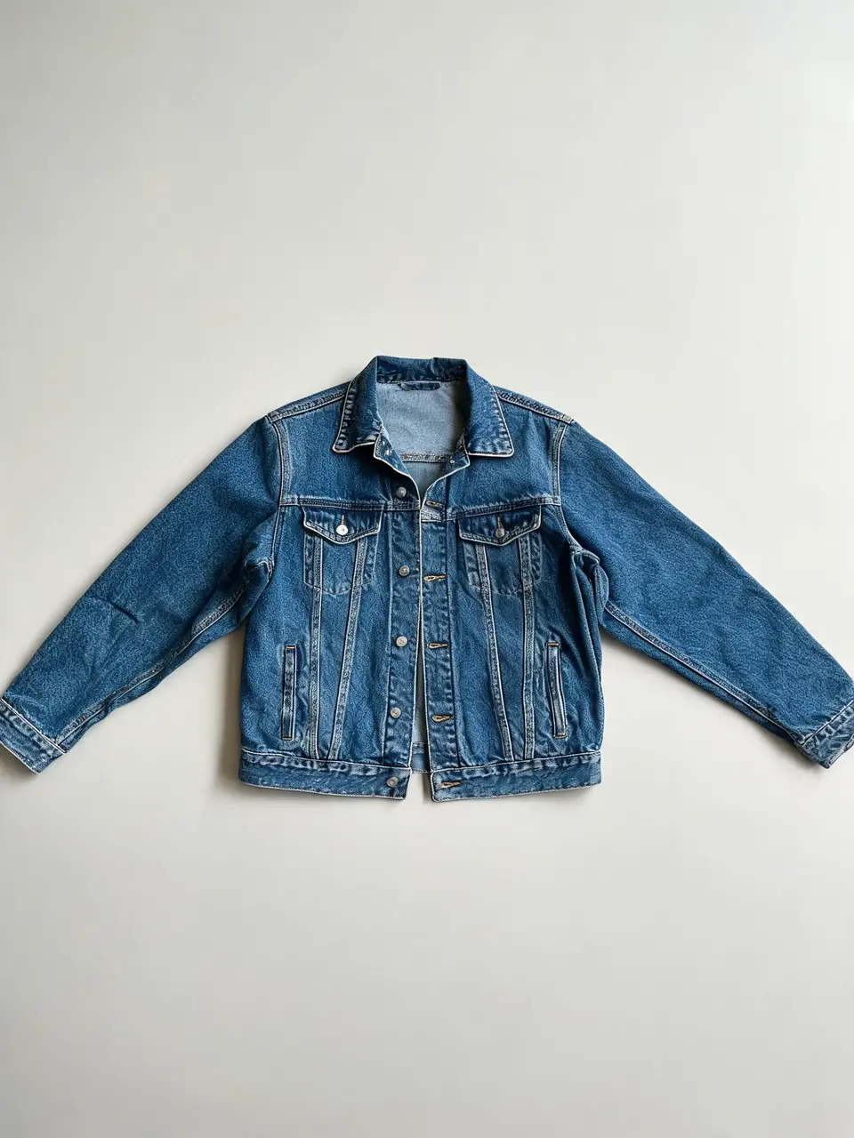 Denim jacket product photo turned into a street-style AI fashion model shot before AI redesign