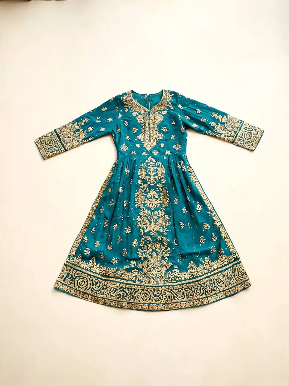 Embroidered ethnic dress flat-lay turned into an elegant on-model photo before AI redesign