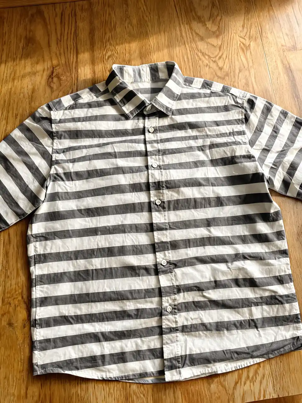 Striped shirt recolored by AI with the stripe pattern preserved after AI redesign