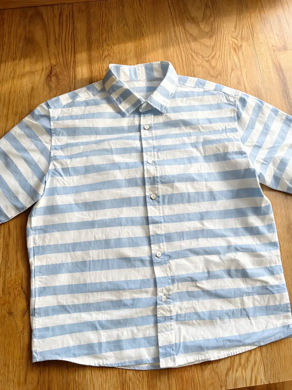 Striped shirt recolored by AI with the stripe pattern preserved before AI redesign
